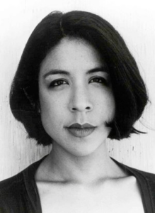 A grayscale portrait of a young woman with chin-length dark hair.